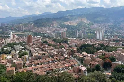 an aerial view of a city with buildings and mountains at New Lovely 3 bedroom condo with an AWESOME view! in Bello