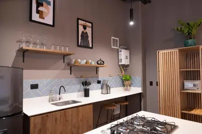a kitchen with a sink and a counter top at Royal Living Poblado in Medellín