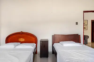 two beds sitting next to each other in a bedroom at Moderna cabaña en Viterbo con Aire AC y Piscina in Viterbo
