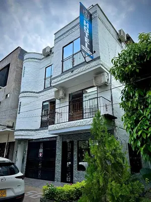 a blue building with a sign on top of it at Hotel SG in Doradal