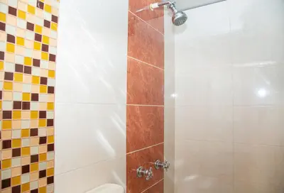 a shower with a glass door in a bathroom at Ayenda 1133 Casa Polty in Manizales