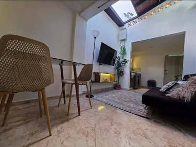 a living room with a table and a couch at alojamiento entero a 800metros estación poblado in Medellín