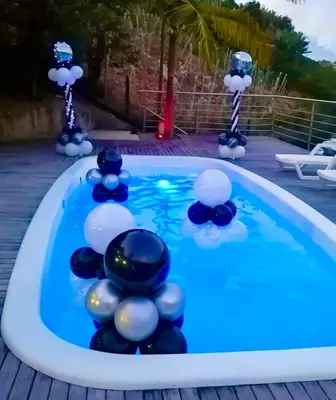 a pool with blue and white balls in the water at Finca Santa Monica Guatape in Guatapé