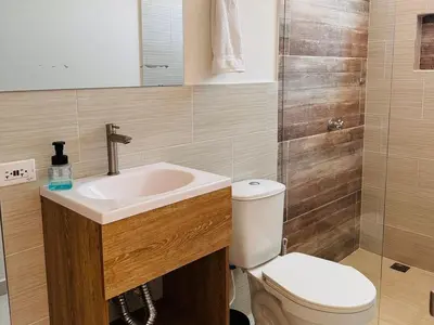 a bathroom with a toilet and a sink at Lagom Apartamentos San Rafael in San Rafael