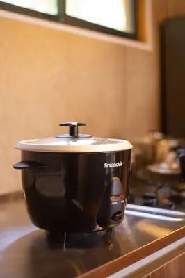 a slow cooker sitting on top of a stove at Cabaña con Jacuzzi en Santa Elena in Medellín