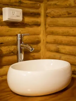 a sink in a bathroom with a faucet at Cabaña con Jacuzzi en Santa Elena in Medellín