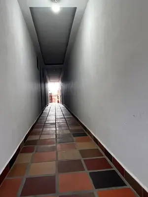 an empty hallway with a tile floor and a ceiling at Loft Terraza Jericó in Jericó