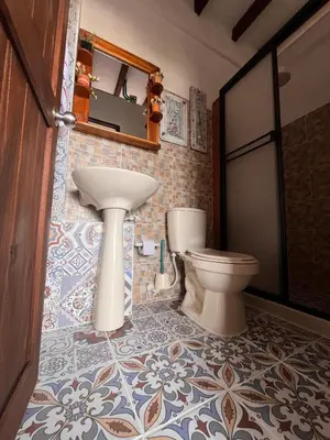 a bathroom with a sink and a toilet at Loft Terraza Jericó in Jericó