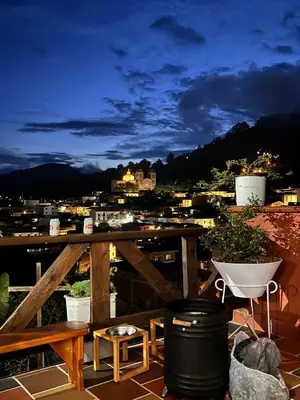 a balcony with a view of a city at night at Loft Terraza Jericó in Jericó