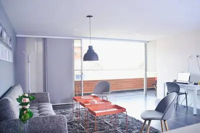 a living room with a couch and a table at Espectacular Apt de 3 habitaciones Deluxe! in Envigado