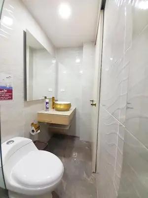 a bathroom with a white toilet and a sink at Precioso apartamento en Medellín con parqueadero gratis laure in Medellín