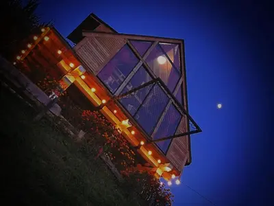 a building at night with lights in front of it at Chalet de Liz - Guatapé in Guatapé