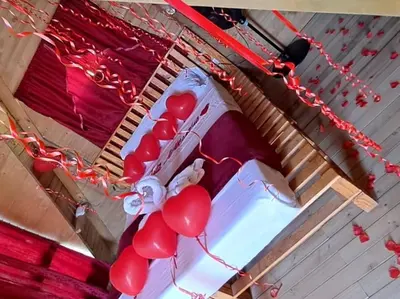 a cake with red balloons on top of it at Chalet de Liz - Guatapé in Guatapé