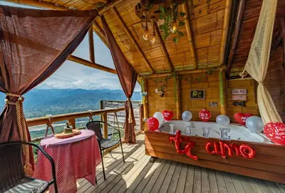 a bath tub on the deck of a house at Glamping Mirador Santa Fe-Sopetran in Sopetran
