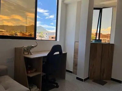 an office with a desk and a window with a view at Puesta de Sol El Carmen de Viboral in Carmen de Viboral