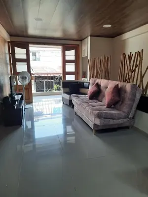 a living room with a couch in the middle at Casa central, segundo piso in Norcasia