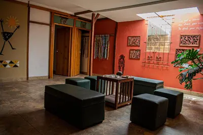 a room with chairs and a table in a room at Refugio del Jaguar in Medellín