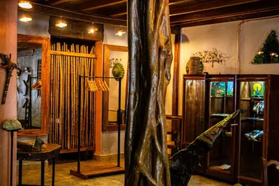 a living room with a dinosaur statue in the middle at Refugio del Jaguar in Medellín