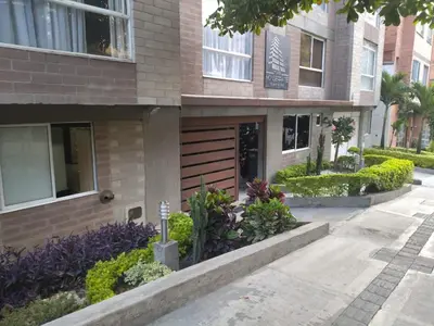 a building with a bunch of plants in front of it at Hermoso loft en medellin in Medellín