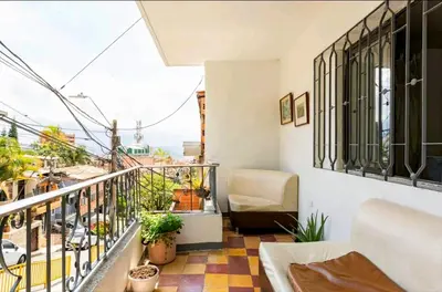 a balcony with a view of a city at Hermosa Habitación in Medellín