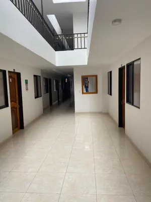 an empty hallway in a building with a ceiling at Hotel la Victoria in San Roque