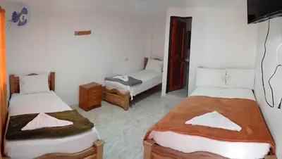 a room with two beds in a room at Hotel la Victoria in San Roque