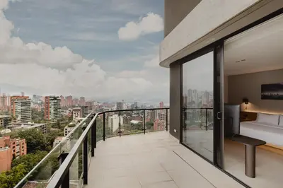 a balcony with a view of a city at Seissta Medellín in Medellín