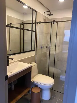 a bathroom with a toilet and a sink and a shower at Fence by Bernalo Hotels in Medellín