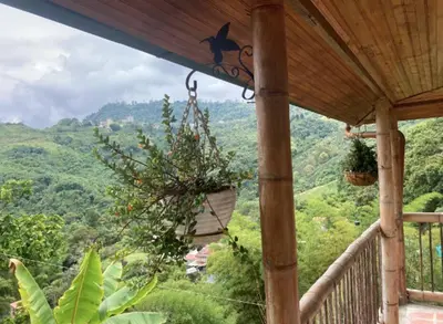 a porch with a view of the mountains at Mirador de los Vientos in Manizales