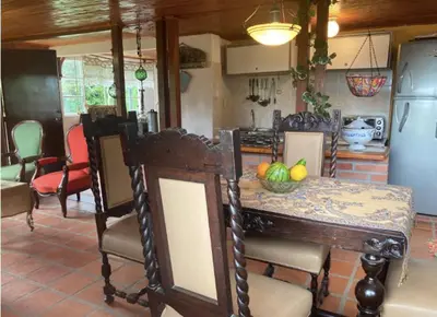 a kitchen with a table with a bowl of fruit on it at Mirador de los Vientos in Manizales