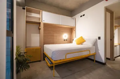 a bedroom with a bed in a room at Indie Universe Creative Hotel in Medellín