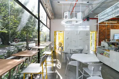a row of tables and chairs in a restaurant at Indie Universe Creative Hotel in Medellín