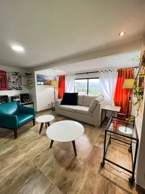 a living room with a couch and a table at Acogedor apto en Sonsón in Sonsón