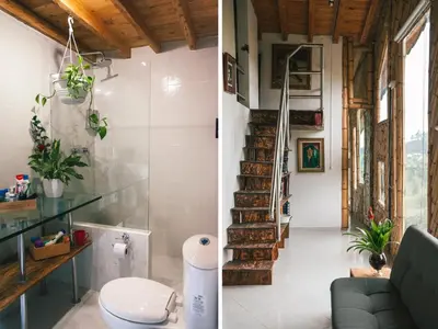 a living room and staircase in a house at Hotel PIA Colombia in Marinilla