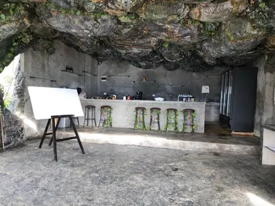 a painting on a stand in front of a kitchen at Cabaña Parque Arvi vista panorámica in Medellín