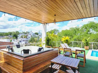 a hot tub on the roof of a house at MIRADORES DEL PARAISO in Doradal