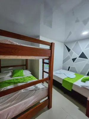a bedroom with two bunk beds in a room at MIRADORES DEL PARAISO in Doradal