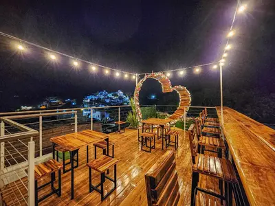 a deck with tables and chairs and lights on a ship at MIRADORES DEL PARAISO in Doradal