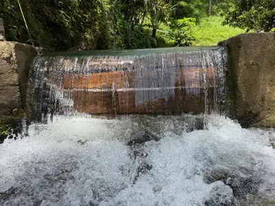a water fall with water coming out of it at Hotel Selva Cristal in San Carlos