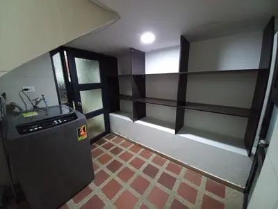 a small kitchen with a sink and a refrigerator at Apartamento amoblado en la Francia in Manizales