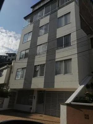 a tall building with a lot of windows at Apartamento amoblado en la Francia in Manizales
