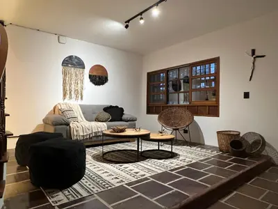 a living room with a couch and a table at Casa Medallo in Medellín