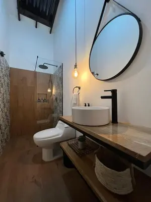 a bathroom with a sink and a mirror at Casa Medallo in Medellín