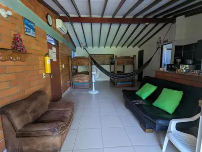 a living room with a couch and a hammock at Apartasol en San Jerónimo, Ciudadela del Sol - Cammar in San Jerónimo