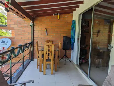 a patio with a table and chairs on a balcony at Apartasol en San Jerónimo, Ciudadela del Sol - Cammar in San Jerónimo