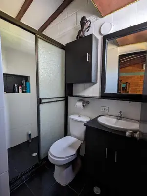 a bathroom with a white toilet and a sink at Apartasol en San Jerónimo, Ciudadela del Sol - Cammar in San Jerónimo