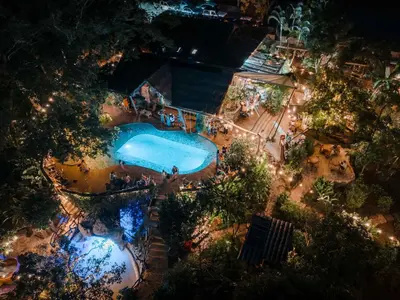 an overhead view of a swimming pool at night at Cerro Tusa Springs in Venecia
