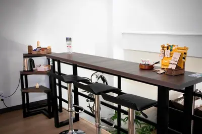 a wooden table with a chair and a table with a table at Apartahotel La Arboleda HC in Manizales