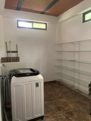 a room with a heater in the corner of a garage at EL MILAGRO FINCA VACACIONAL in San Rafael