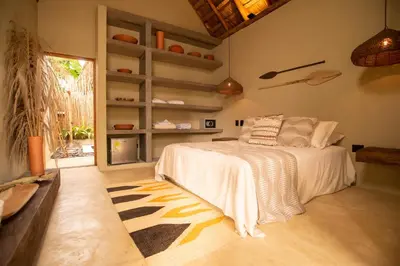 a bedroom with a bed in a room at Nativa Refugio Escondido in Santa Fe de Antioquia